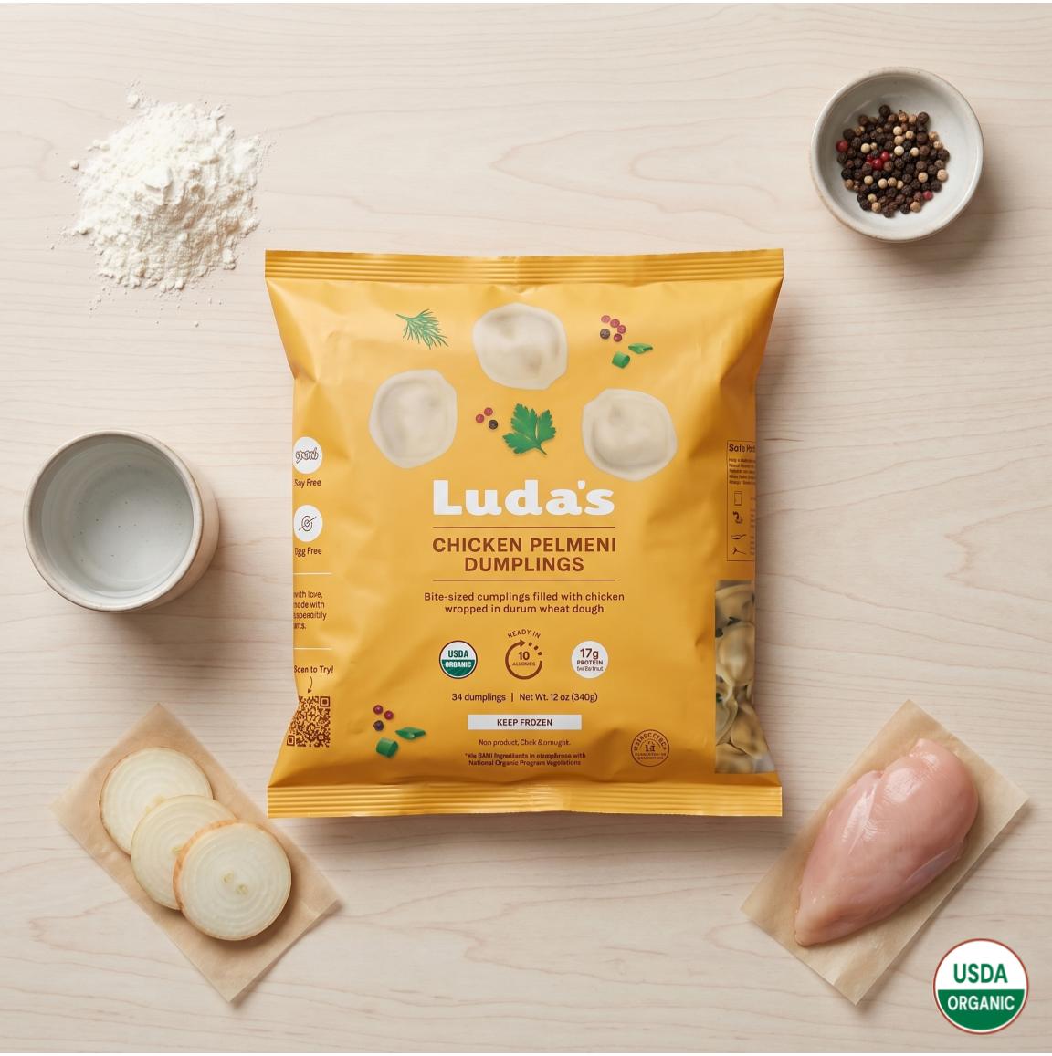 Steaming Luda's pelmeni plated with sour cream