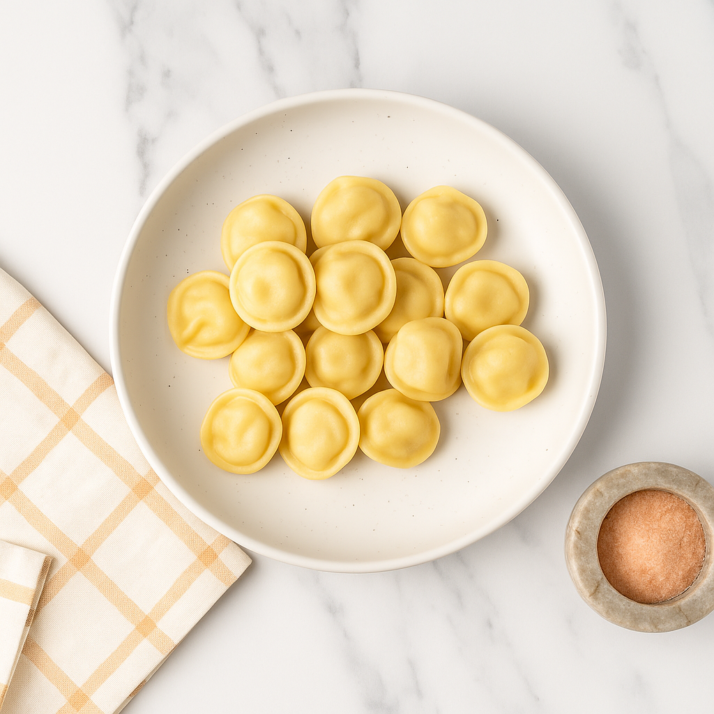 Chicken pelmeni dumplings, clean, on a white plate