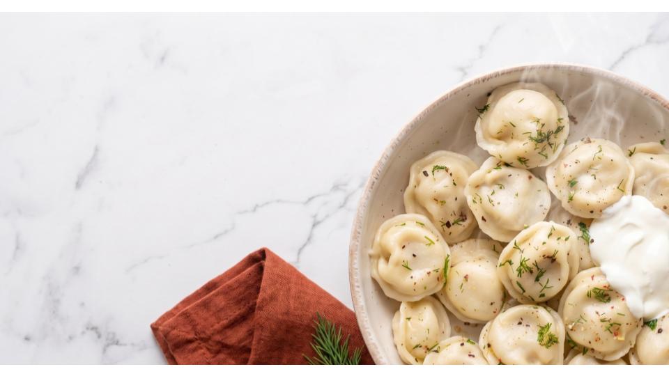 Luda's organic dumplings, plated with sour cream