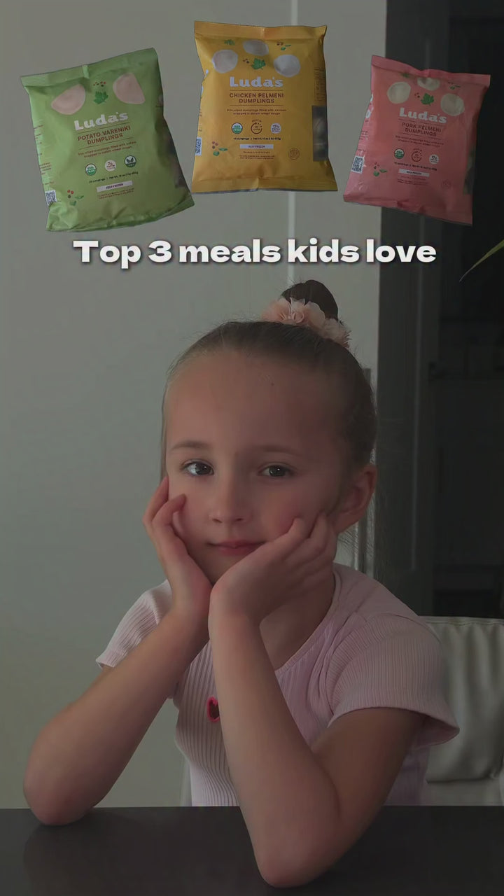 Kids' favorite meal: a child eating a plate of Luda's pelmeni dumplings
